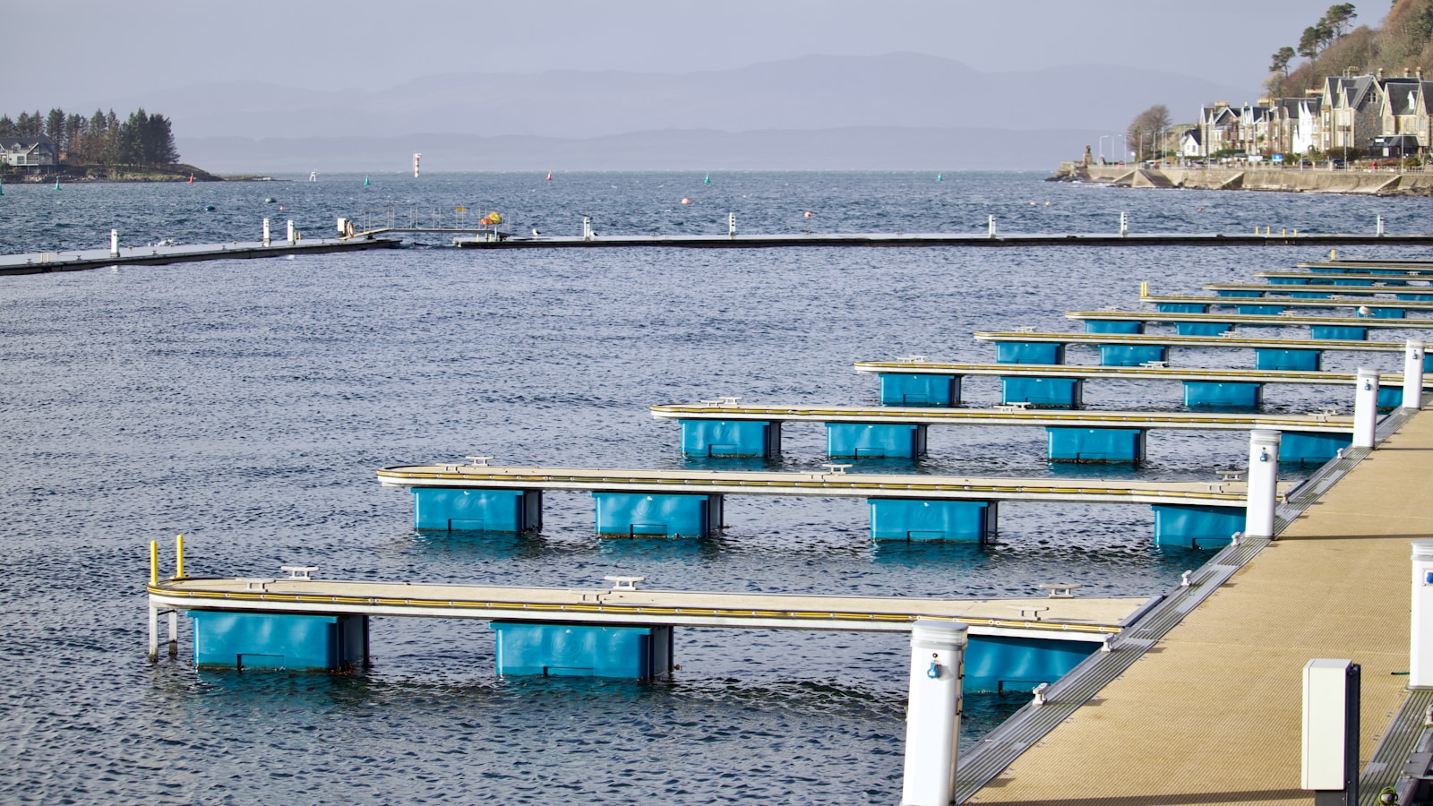 a dock with blue and white containers